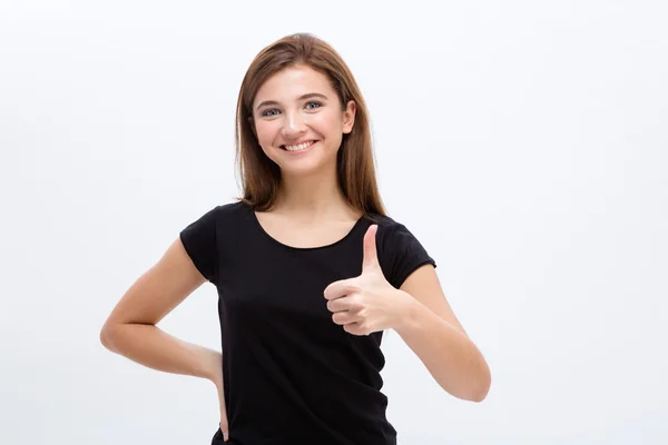 Positive pretty cheerful young woman showing thumbs up — Stock Photo, Image