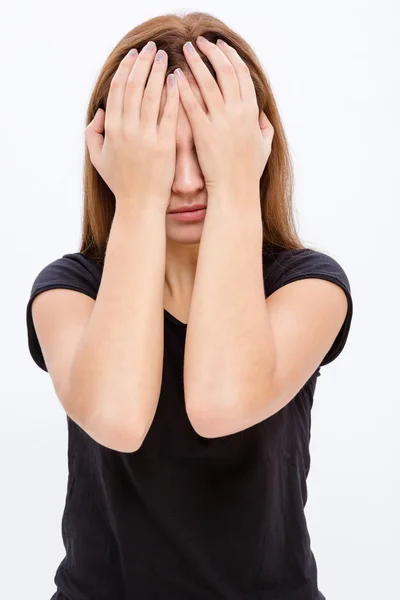 Stressed desperate young woman covered eyes by hands Royalty Free Stock Photos