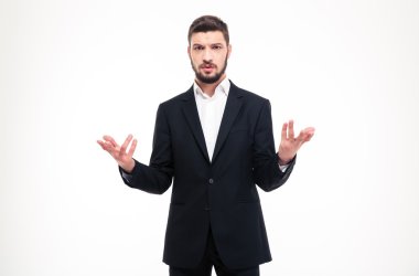 Handsome puzzled businessman with beard holding copyspace in both hands