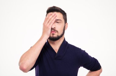 Disappointed stressed bearded young man  with closed eyes clipart
