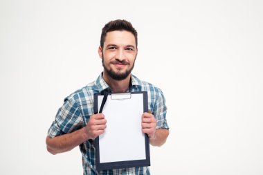 Happy smiling bearded man in checkered shirt holding blank clipboard