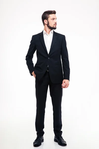Full length portrait of a confident businessman looking away — Stock fotografie