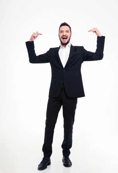 Handsome cheerful businessman in suit laughing and pointing on himself — Stockfoto