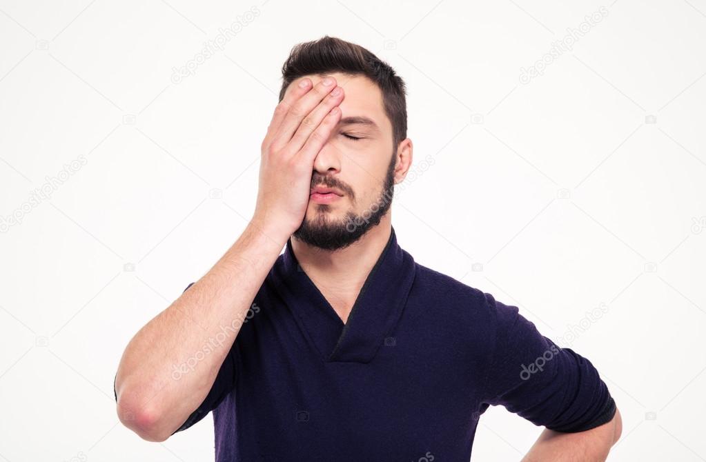 Disappointed stressed bearded young man  with closed eyes