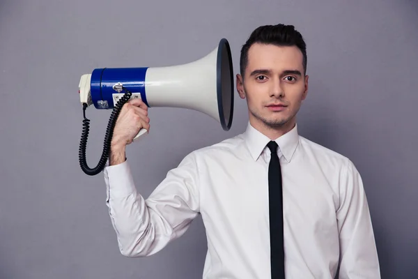 Businessman holding loudspeaker — Stock Photo, Image