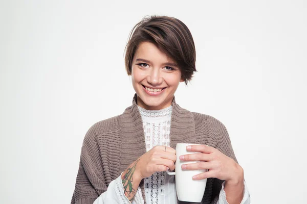 Alegre atractiva joven hembra sosteniendo taza blanca y beber —  Fotos de Stock