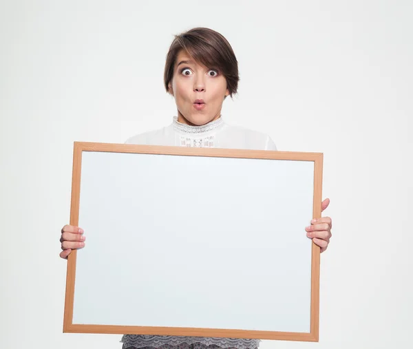 Amazed funny young woman holding blank board — Stock Photo, Image