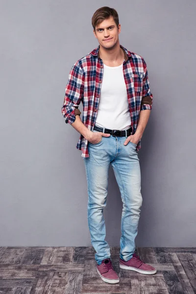 Full length portrait of handsome confident  man in checkered shirt — Stock Photo, Image