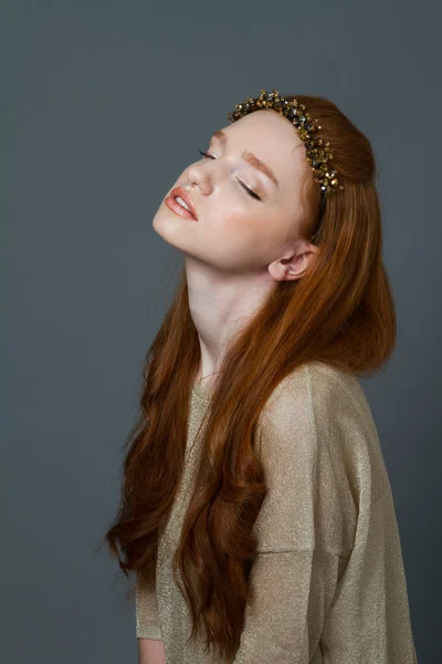 Cute redhead woman with hoop on her head — Stock Photo, Image