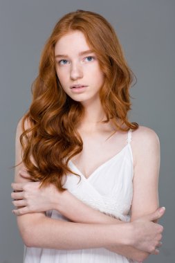 Attractive redhead woman looking at camera