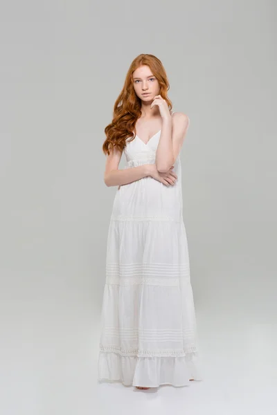 Full length portrait of a pretty redhead woman in dress — Stock Photo, Image