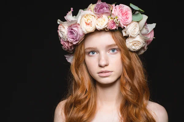 Cute redhead woman with wreath from flowers on head — Stock Photo, Image