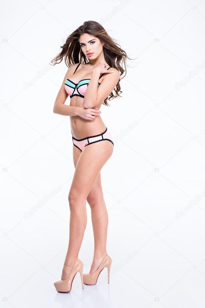 Portrait of a beautiful young woman wearing bodysuit, white stockings,  sneakers and glasses Stock Photo