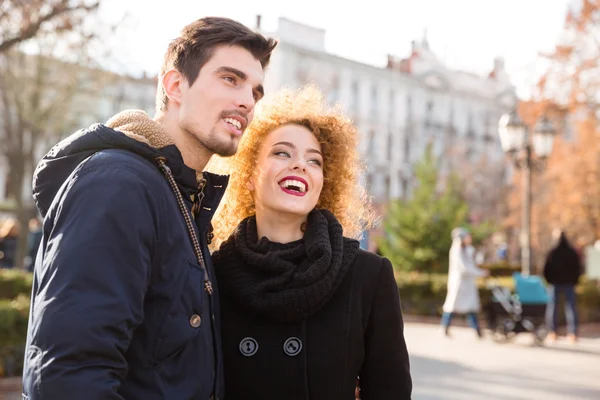 Couple looking on something outdoors — Stock Photo, Image