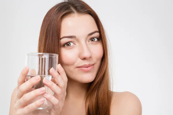 Pretty smiling young woman with glass of water — ストック写真