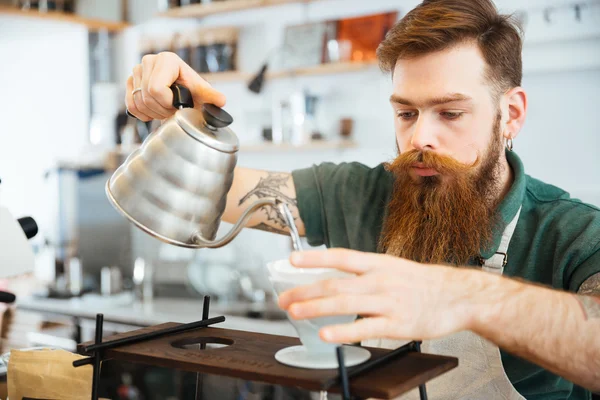 Barista pouring water on coffee ground with filter — Stock Photo, Image
