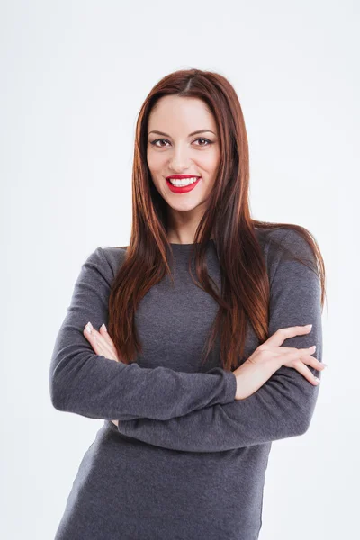 Happy beautiful young woman standing with arms crossed — Stock Photo, Image