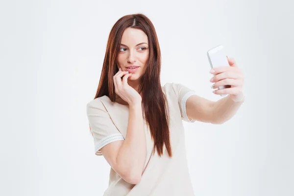 Happy woman making selfie photo on smartphone — Stock Photo, Image