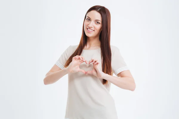 Krásný úsměv mladá žena zobrazeno srdce s prsty — Stock fotografie
