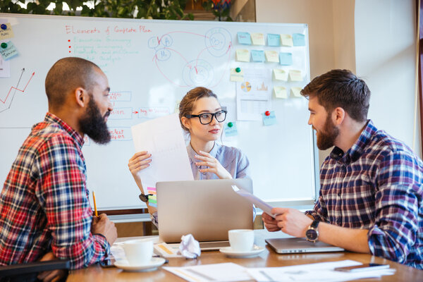 Business people preparing for presentation together 