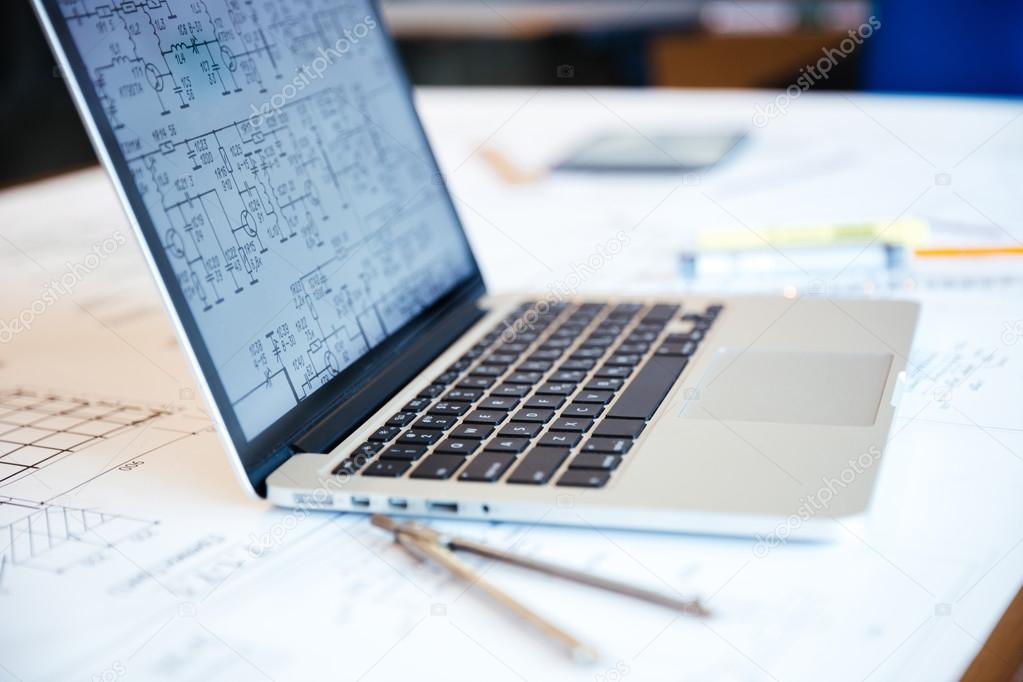 Laptop computer with blueprints on screen — Stock Photo © Vadymvdrobot