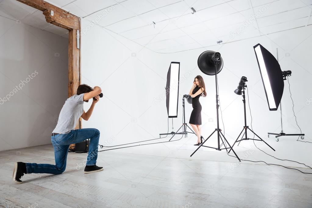 Photographer working with model in studio 