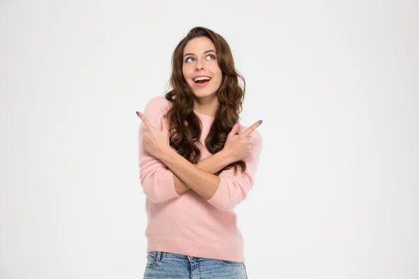 Woman showing fingers away and looking up — Stock Fotó