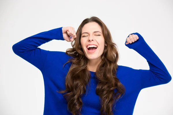 Ecstatic excited successful young woman with raised hands celebrating victory — ストック写真