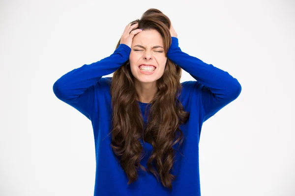 Desperate pretty woman with hands on head suffering from headache — Stockfoto