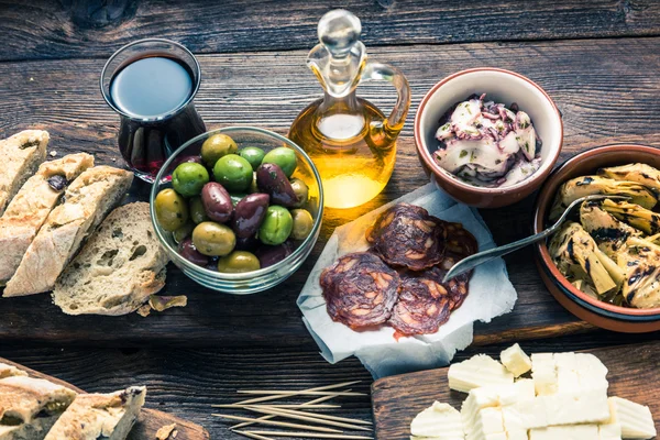 Tapas served in restaurant or bar on wooden table — Stock Photo, Image