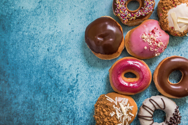 Tasty treat donuts, food border background