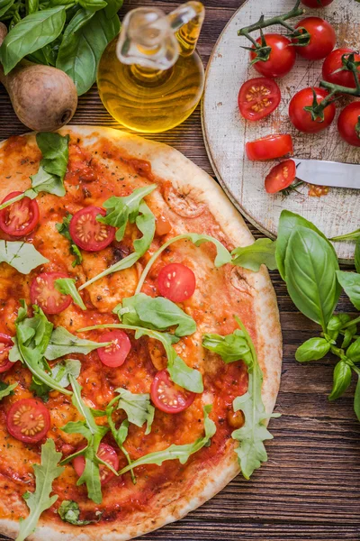 Margherita pizza on wooden table — Stock Photo, Image