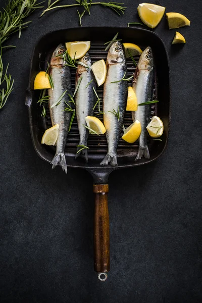 Fresh whole fish on frying pan — Stock Photo, Image