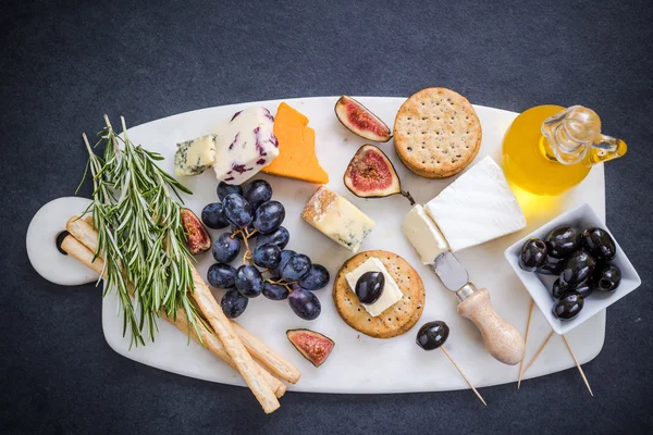Cheese selection on marble board — Stock Photo, Image