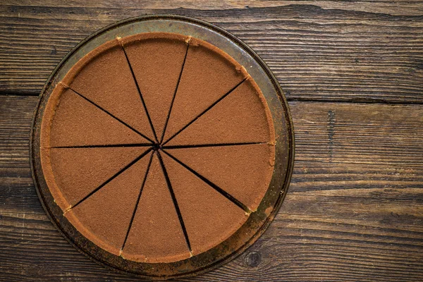 Chocolate cake on wooden table — Stock Photo, Image