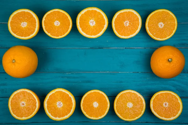 Fresh organic oranges on wooden background — Stock Photo, Image