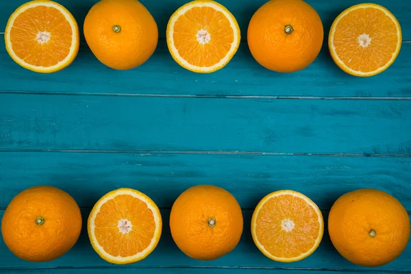 Fresh organic oranges on wooden background — Stock Photo, Image