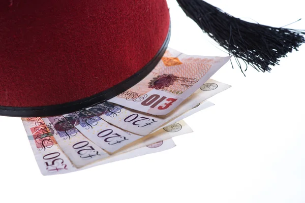 Hotel boy hat and british money isolated — Stock Photo, Image