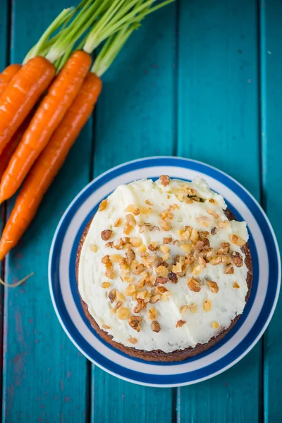 Traditional carrot cake and fresh carrots