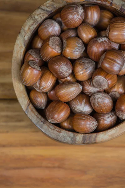 Table top view over bowl with hazelnuts — Stock Photo, Image