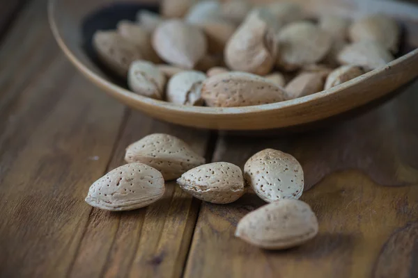 Table top view on almonds in bowl — Stock Photo, Image