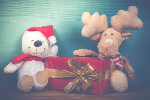 Christmas soft toys in vintage style on wooden background — Stock Photo, Image