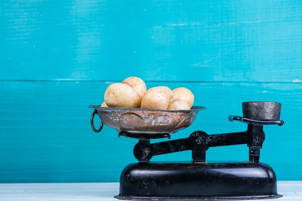 Farm fresh potatoes on vintage scale — Stock Photo, Image