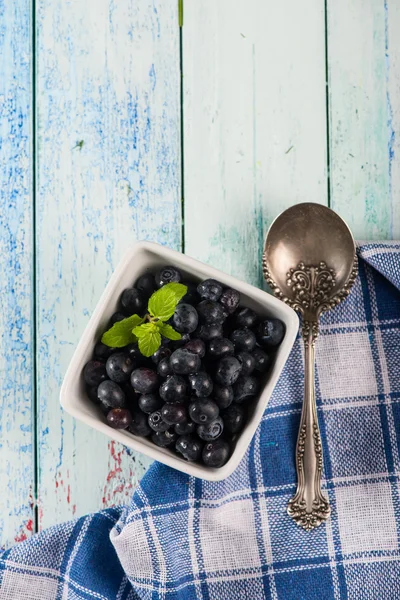 Table top view on pot with blueberries — Stock Photo, Image