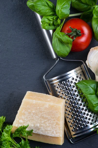 Selection of italian tipical food on black background from above