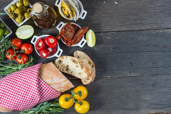 Spanish tapas on wooden rustic table from above — Stock Photo, Image