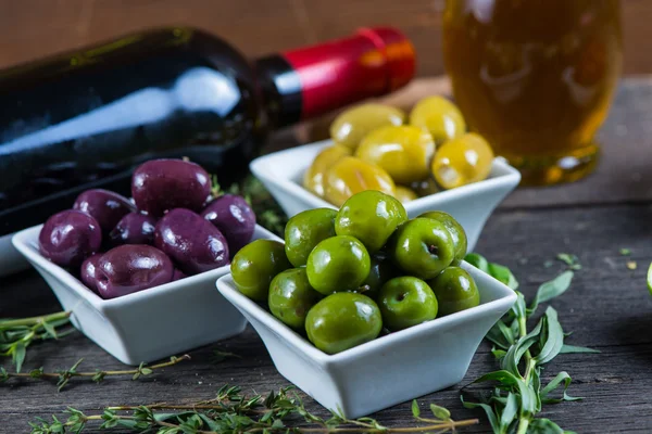 Selection of fresh olives with herbs — Stock Photo, Image