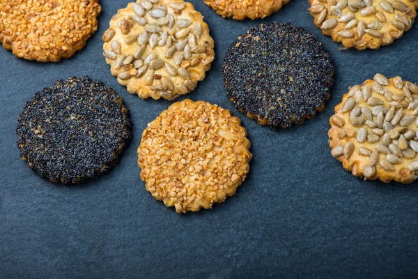 Healthy snacks with seeds, food background from above