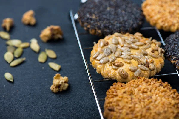 Homemade healthy cookie with seeds on cooling tray — Stock Photo, Image