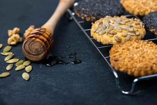 Homemade healthy cookie with seeds and honey on cooling tray — Stock Photo, Image